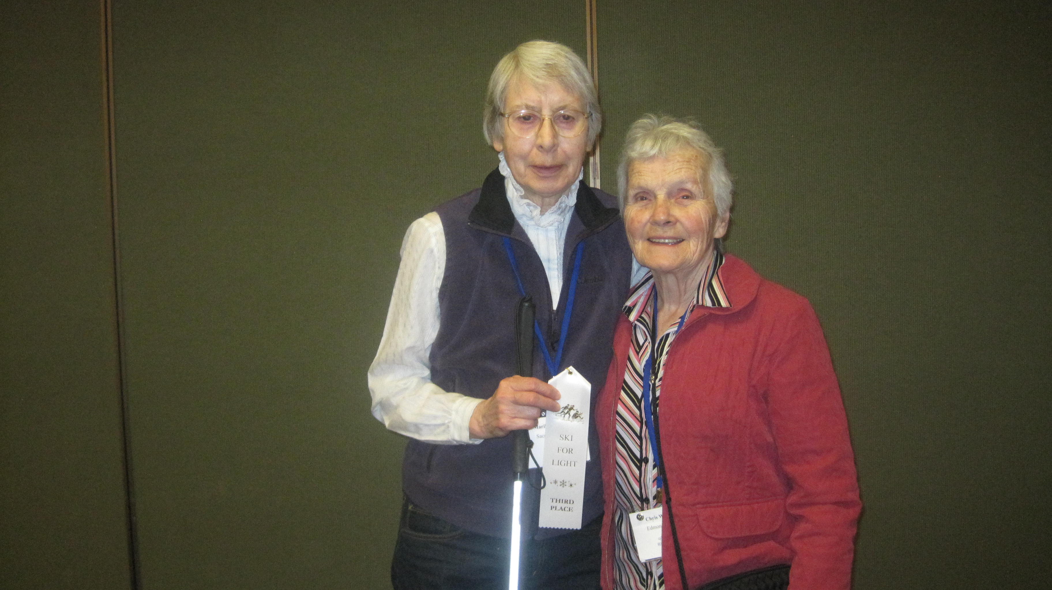 Chris with skier Marilyn, with her 3rd place medal